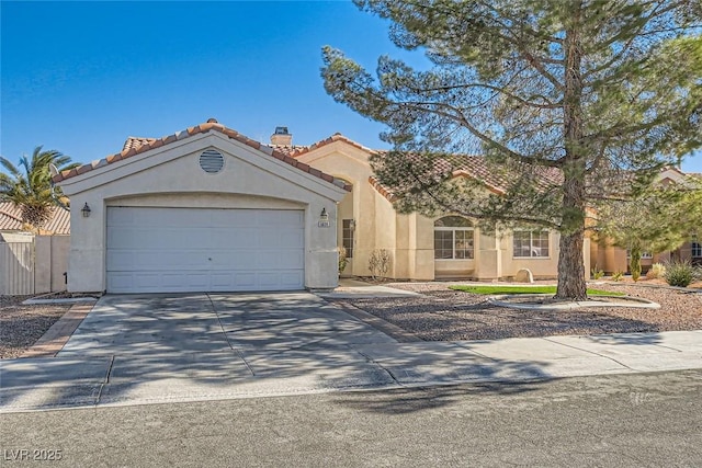 mediterranean / spanish-style house featuring a garage