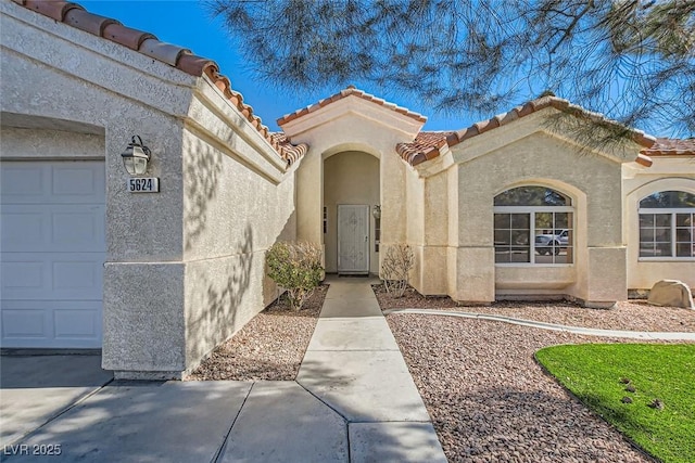 doorway to property featuring a garage