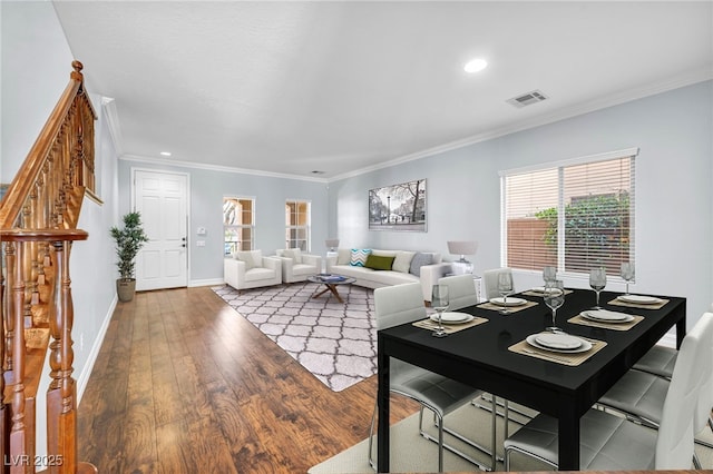 living room with crown molding and wood-type flooring