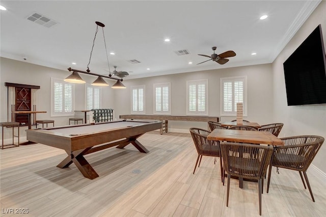 recreation room with light wood-type flooring, ceiling fan, crown molding, and billiards