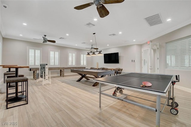 playroom featuring ceiling fan and crown molding