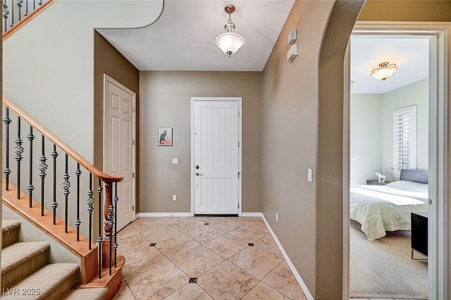 foyer entrance featuring light tile patterned floors