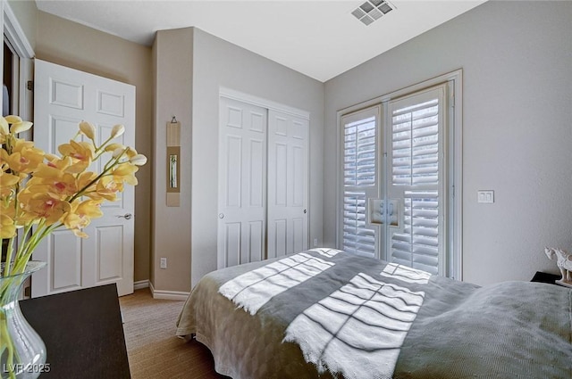 carpeted bedroom with a closet