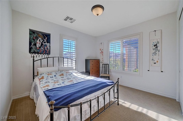 bedroom with light carpet