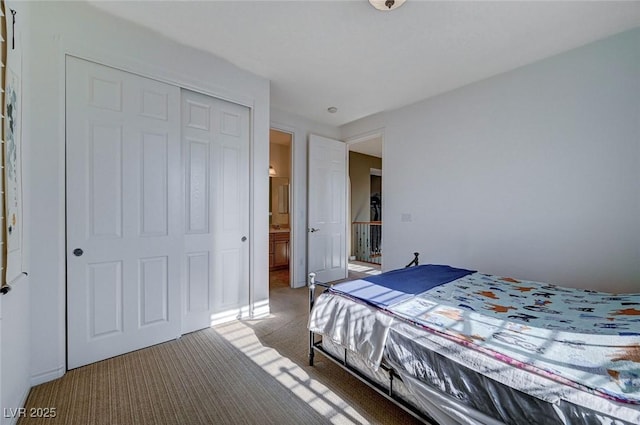 bedroom with a closet and carpet