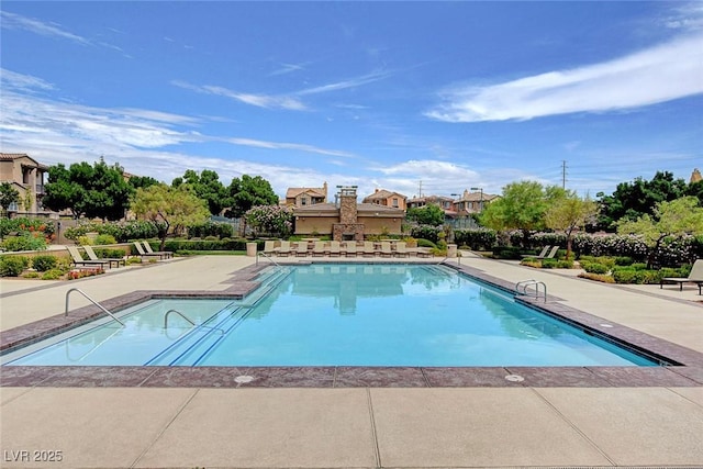 view of swimming pool with a patio area