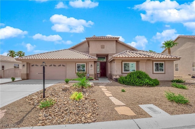 mediterranean / spanish-style house featuring a garage