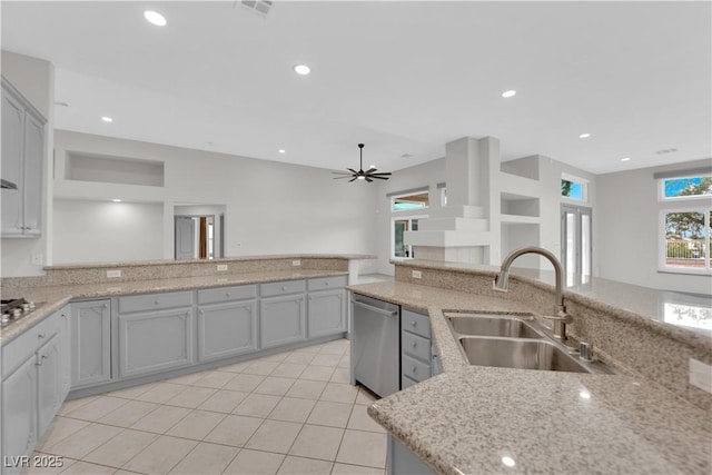 kitchen featuring light tile patterned floors, gray cabinets, appliances with stainless steel finishes, ceiling fan, and sink