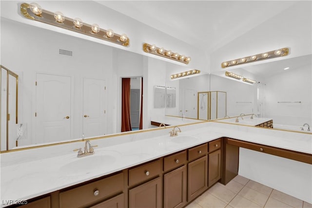 bathroom featuring lofted ceiling, tile patterned flooring, and vanity