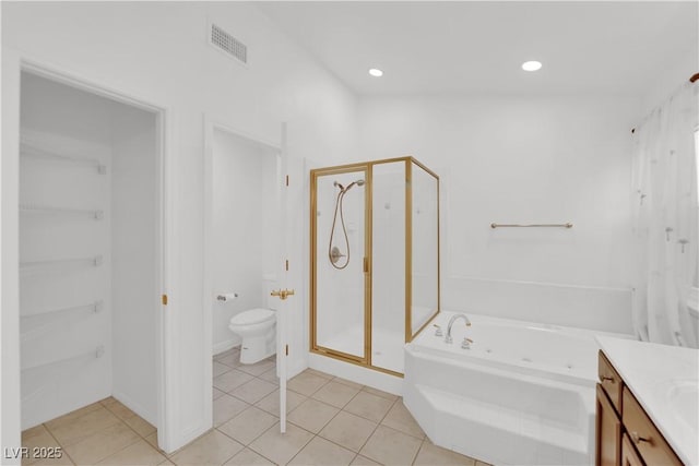 full bathroom featuring independent shower and bath, vanity, tile patterned floors, and toilet