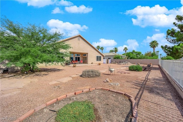 back of property with a patio