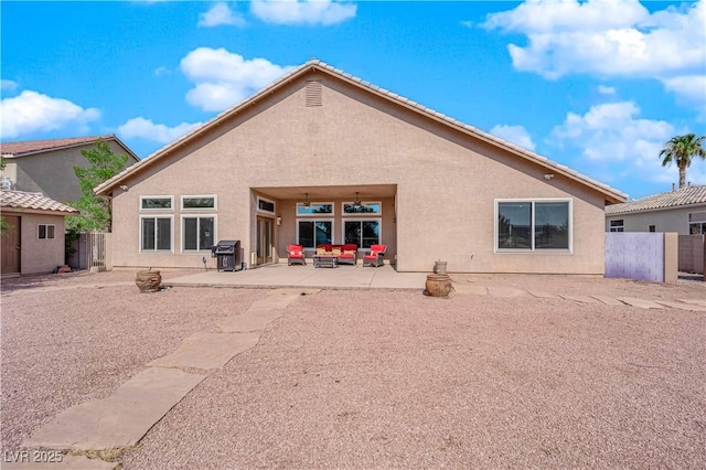 back of house with a patio