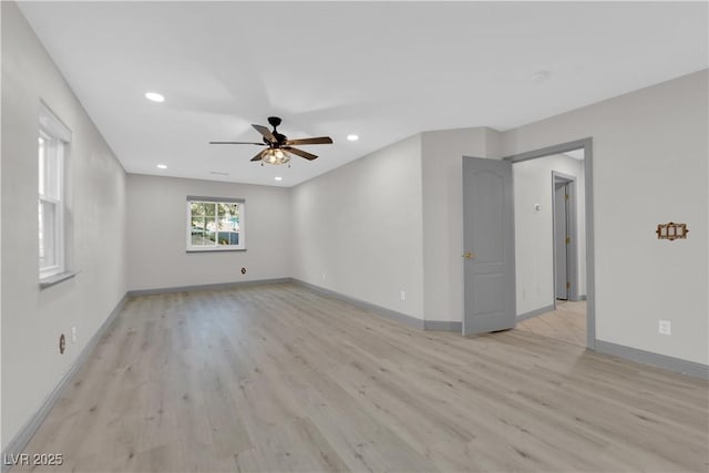 unfurnished room with light wood-type flooring and ceiling fan