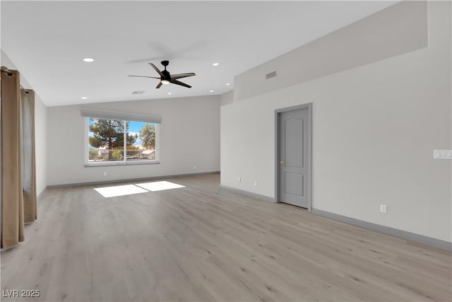 unfurnished room featuring ceiling fan, light hardwood / wood-style flooring, and lofted ceiling