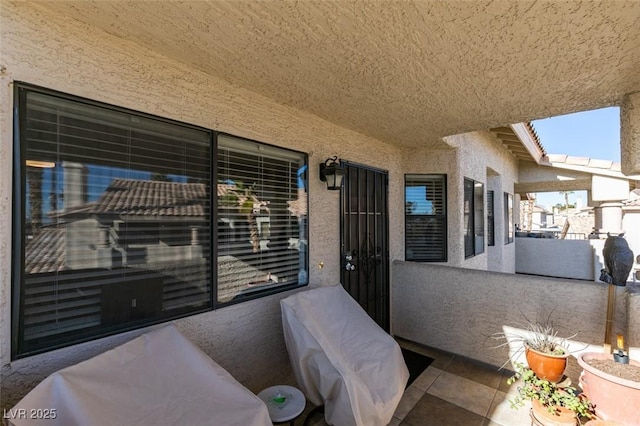 view of patio with a balcony