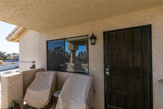 entrance to property featuring a balcony