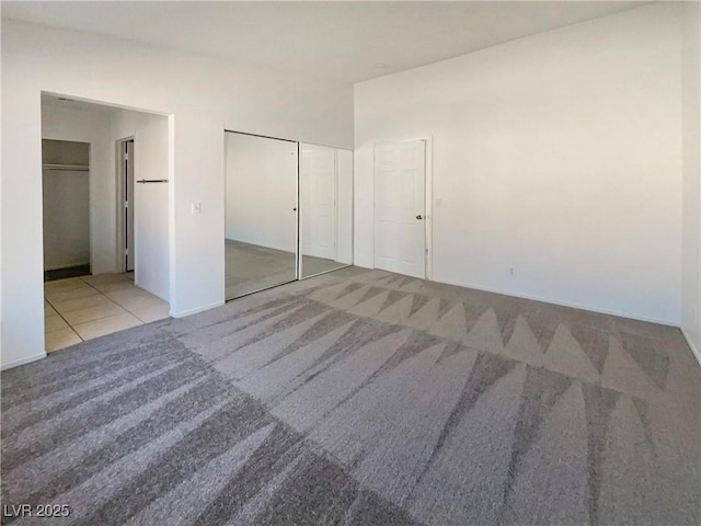 unfurnished bedroom featuring light colored carpet