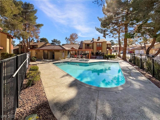 view of swimming pool with a patio