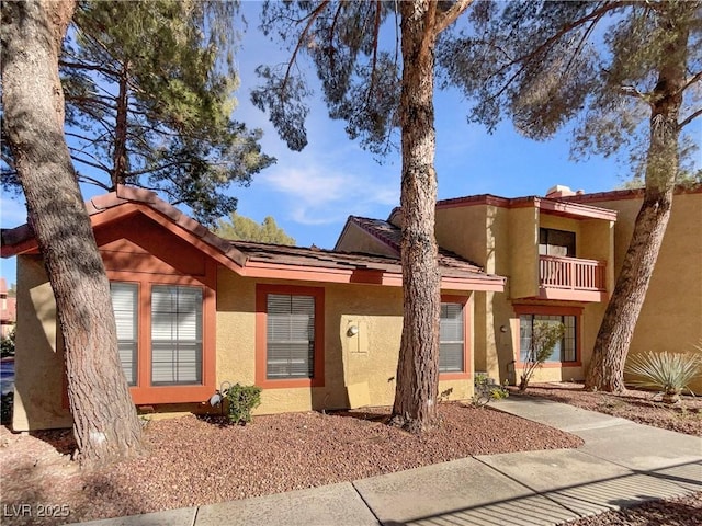 view of front of property with a balcony