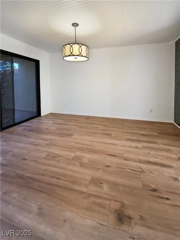 unfurnished dining area with wood-type flooring