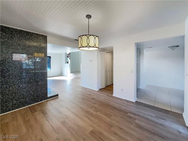 unfurnished dining area featuring hardwood / wood-style flooring