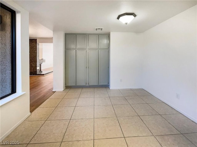 unfurnished bedroom featuring light tile patterned flooring