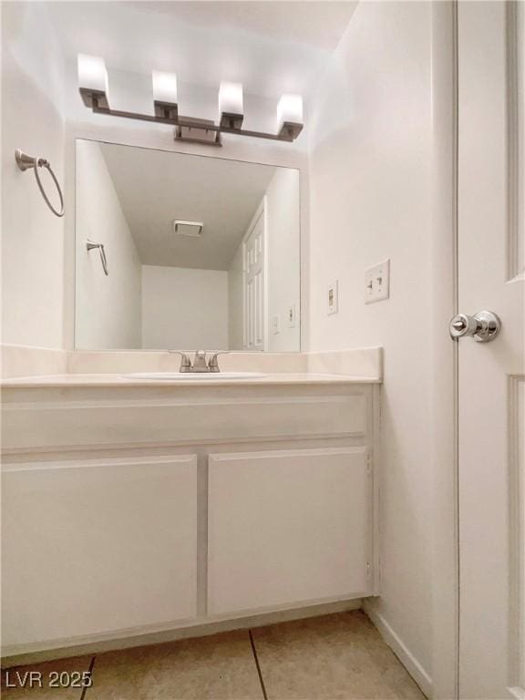 bathroom with vanity and tile patterned flooring