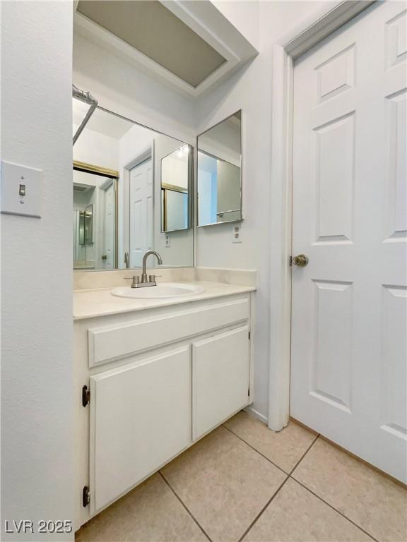 bathroom with vanity and tile patterned floors