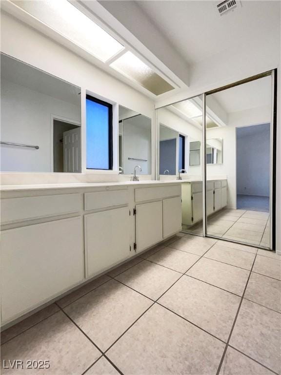 bathroom featuring vanity and tile patterned flooring