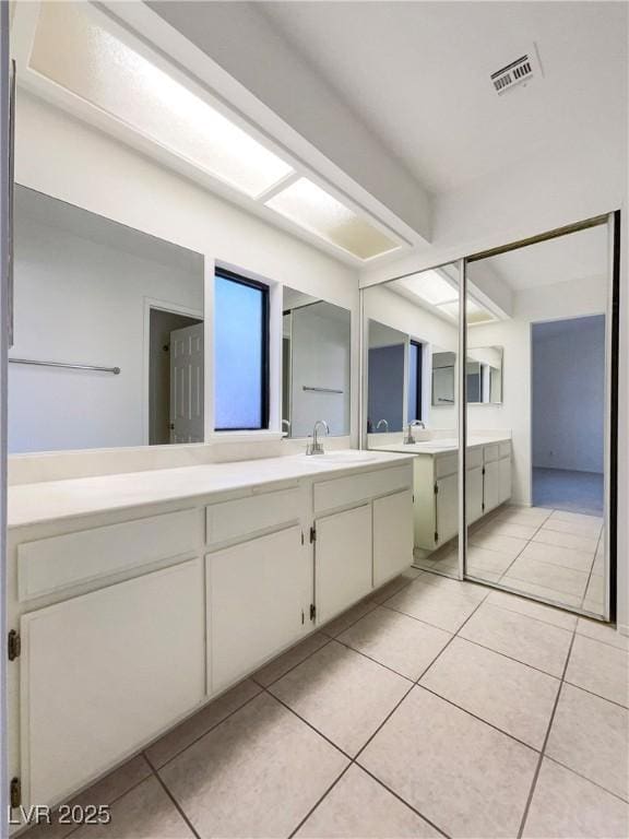 bathroom featuring tile patterned floors and vanity