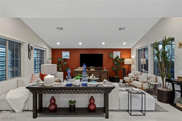 living room featuring lofted ceiling