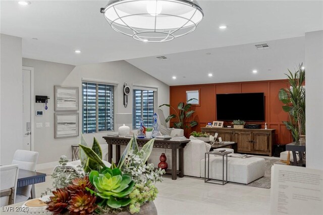 living room with lofted ceiling