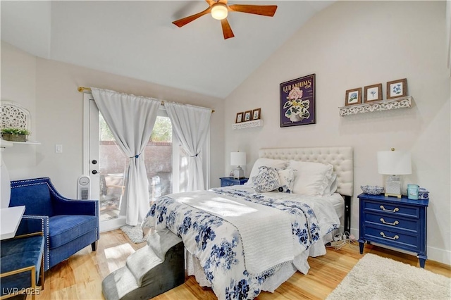 bedroom featuring vaulted ceiling, access to exterior, ceiling fan, and light hardwood / wood-style floors