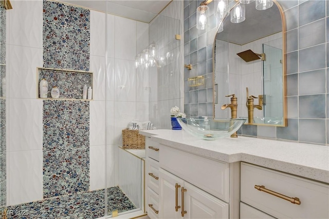 bathroom featuring tile walls, a shower, and vanity