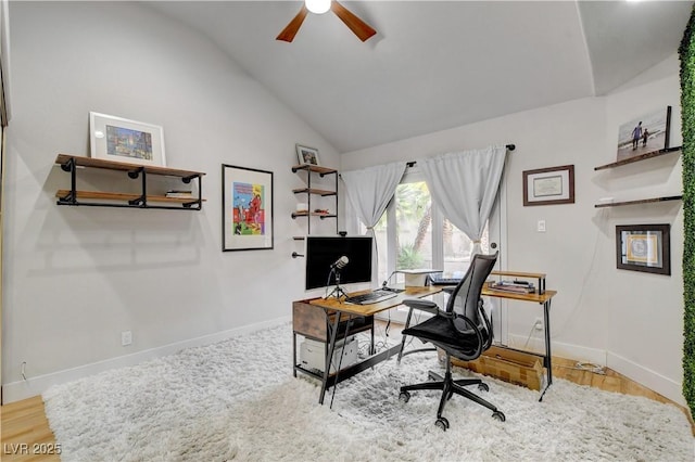 home office with lofted ceiling, ceiling fan, and hardwood / wood-style flooring