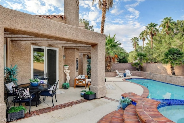 view of swimming pool with a patio