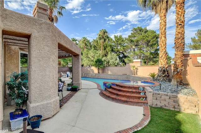 view of patio with a pool with hot tub