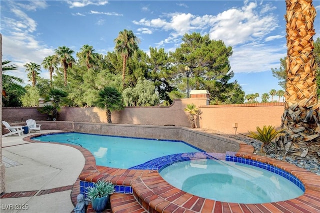 view of pool featuring an in ground hot tub