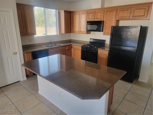 kitchen featuring black appliances, a kitchen island, sink, and light tile patterned floors