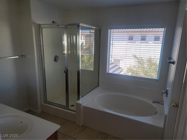 bathroom featuring separate shower and tub, tile patterned flooring, and vanity