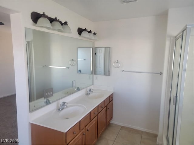 bathroom featuring walk in shower, tile patterned flooring, and vanity