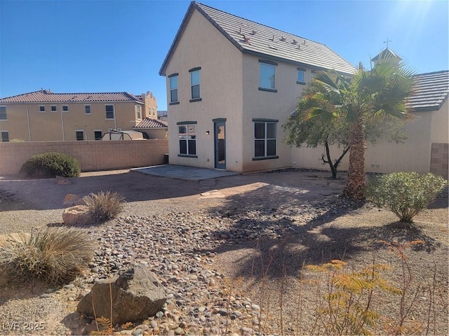 back of house with a patio area