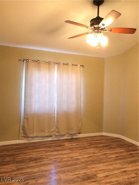 spare room featuring ceiling fan and hardwood / wood-style flooring