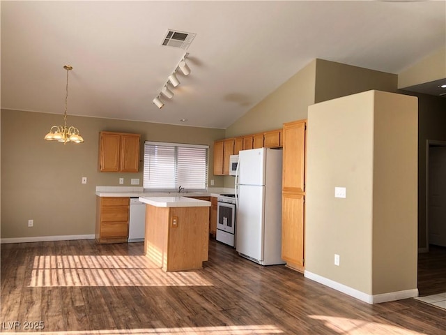 kitchen featuring sink, an inviting chandelier, white appliances, hanging light fixtures, and a kitchen island