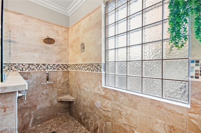 bathroom with tiled shower, tile walls, and ornamental molding