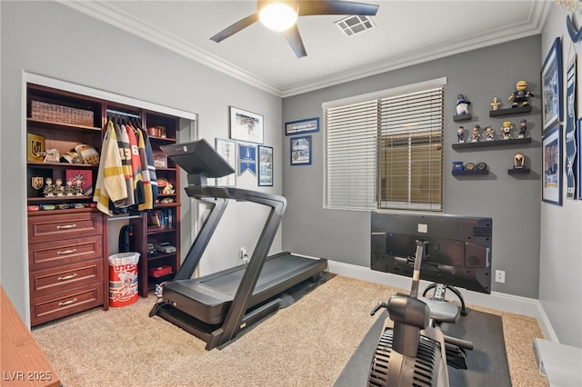 exercise area featuring light colored carpet, ceiling fan, and crown molding