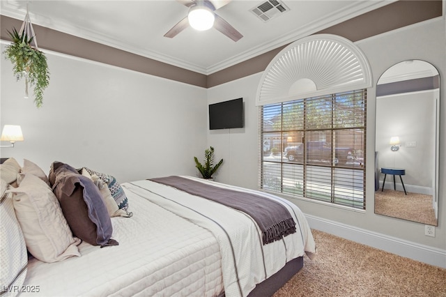 bedroom featuring carpet floors, ceiling fan, and crown molding