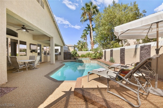 view of swimming pool with ceiling fan and a patio area