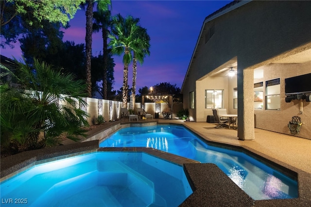 view of pool featuring a patio area and an in ground hot tub