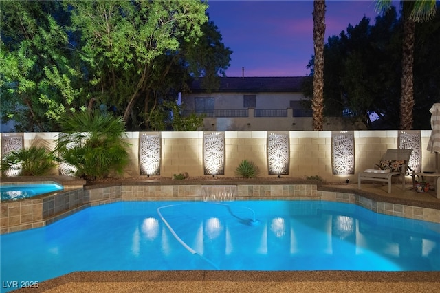 view of pool at dusk